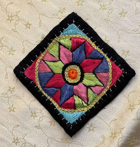 Hand-embroidered tablecloth